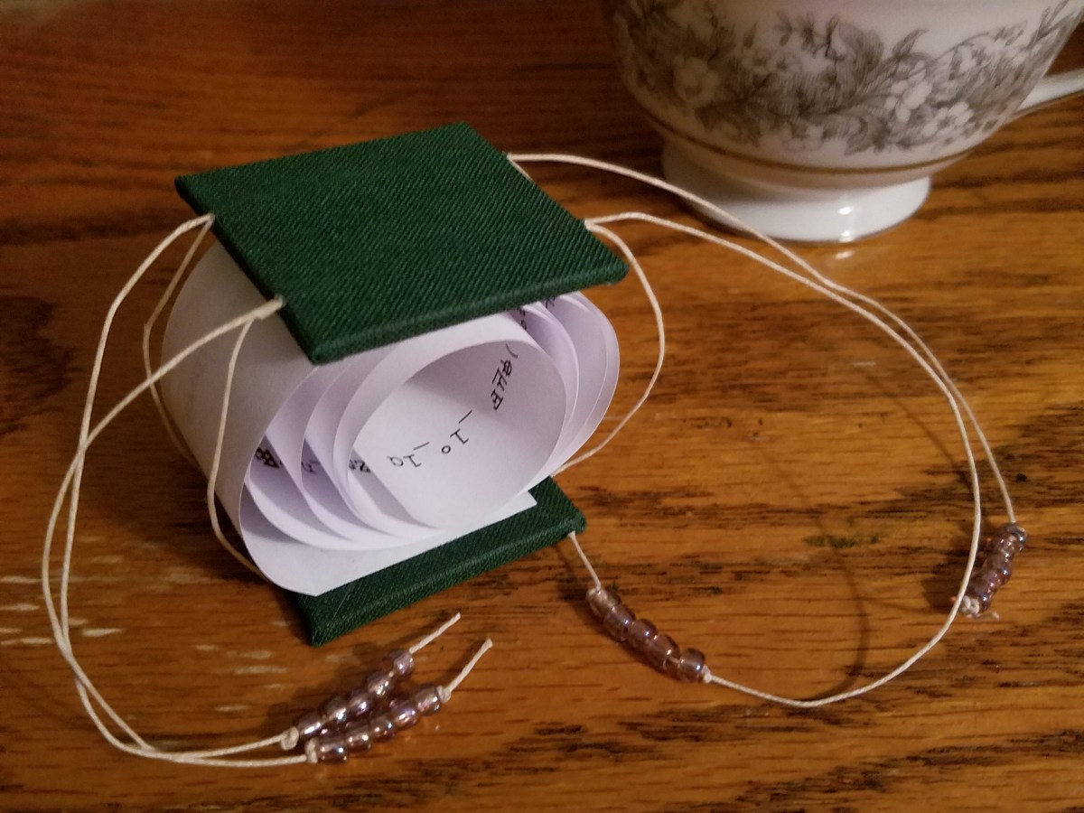 Drawstring coil book