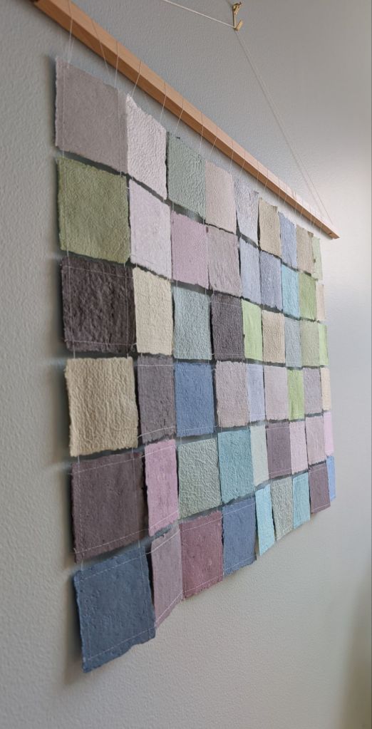 Paper tapestry viewed from a close perspective to the left.